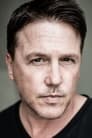 Lochlyn Munro isAgent Jake Harper